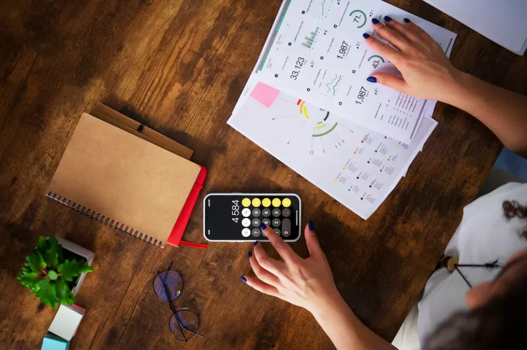 a person calculating average cost of goods sold in a restaurant